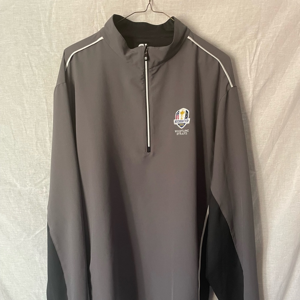 Three quarter zip long sleeve golf shirt w/ 2020 Ryder Cup logo.